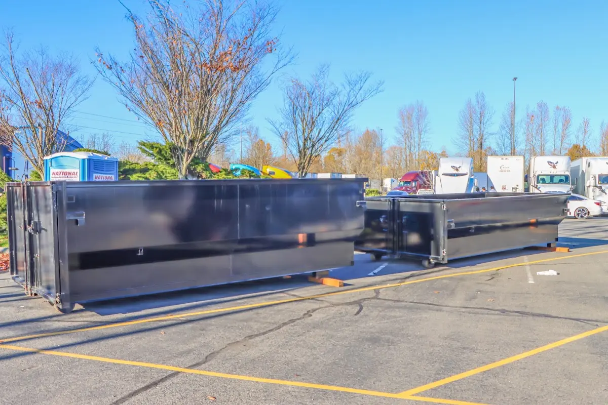 Professional dumpster rental service with roll-off container on residential driveway in Nappanee